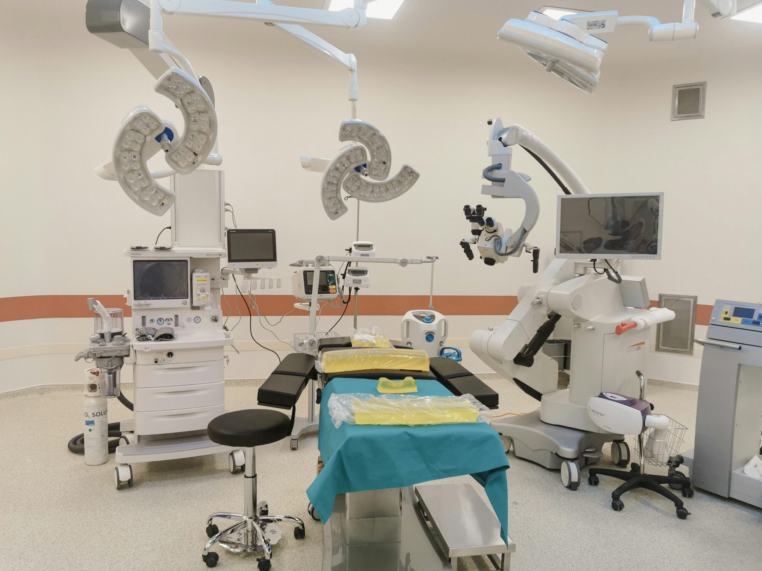 A state-of-the-art operating room fully equipped with advanced medical devices and surgical tools.